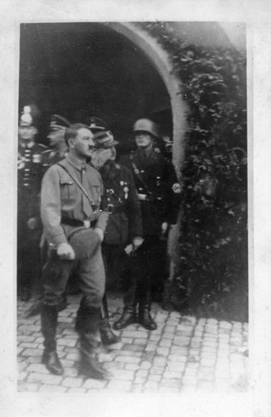 Adolf Hitler leaves Kelheim's city hall after a speech for the Reichstag election campaign
